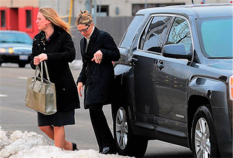 Rita Crundwell, right, the former comptroller of Dixon, Ill., who pleaded guilty in November 2012 to wire fraud, admitting she stole nearly $54 million from the city of Dixon, arrives with her attorney Kristin Carpenter at the federal courthouse for her sentencing in Rockford, Ill., Thursday, Feb. 14, 2013.