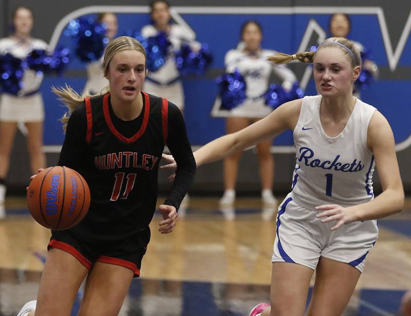 Huntley's Anna Campanelli brings the ball up the court against Burlington Central's Kenzie Andersen during a Fox Valley Conference girls basketball game on Friday, Dec. 15, 2023, at Burlington Central High School.