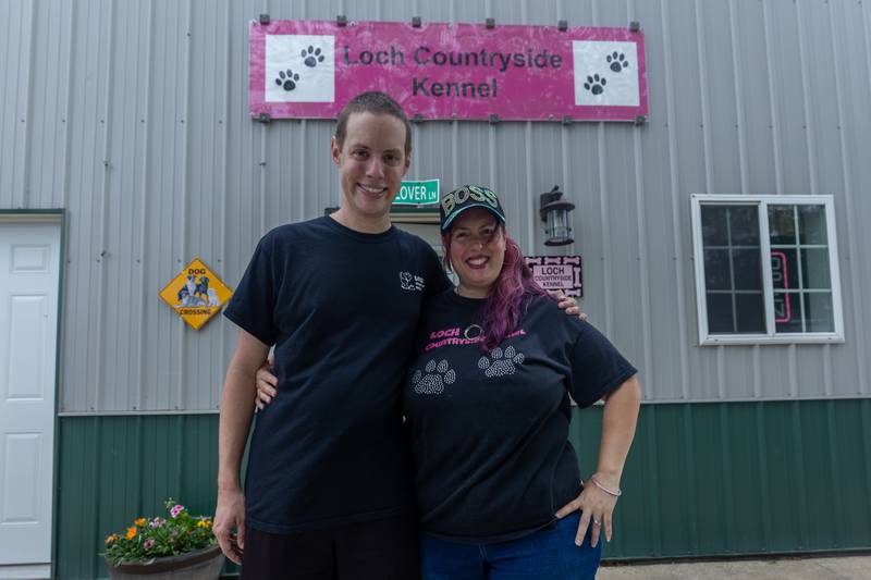 (left to right) Alex Martorano stands next to mom/owner of Loch Countryside Kennel Laura Loch on Friday, June 27, 2025 at Loch Countryside Kennel in Peru.