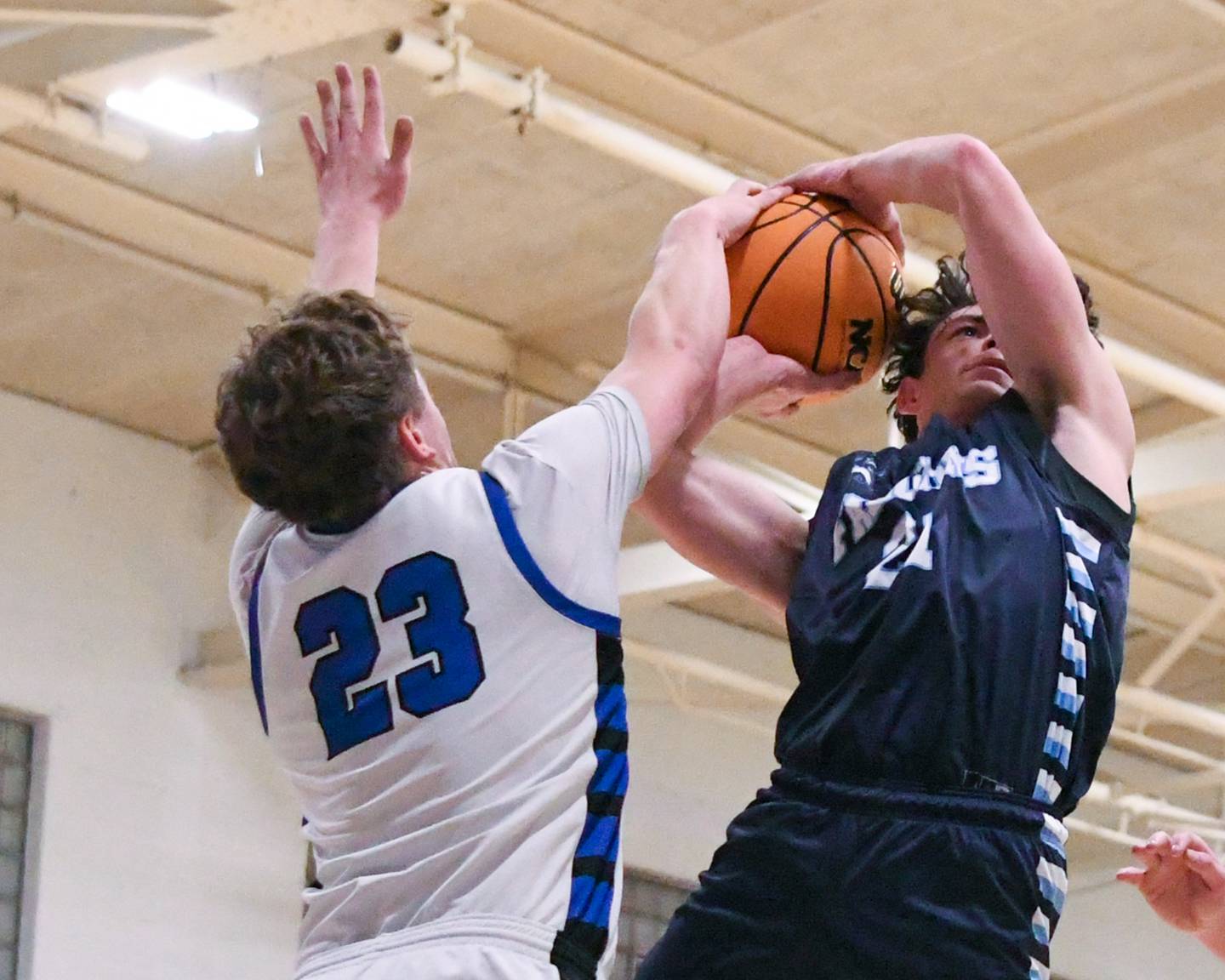 Parkview Christian Academy's Tristian Mersman, right, gets his shot blocked by Hinckley-Big Rock's Luke Badal (23) during the 1A regional championship game on Friday Feb. 27, 2026, held at Hinckley-Big Rock High School.
