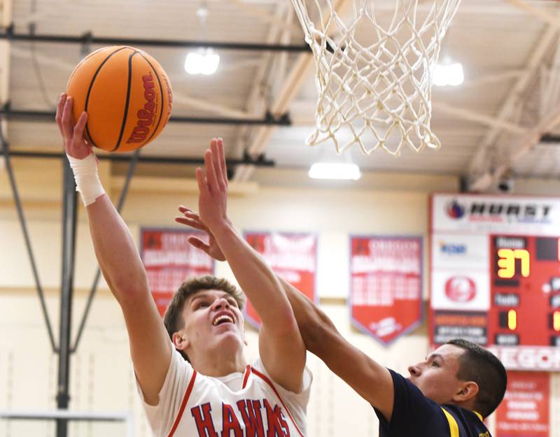 Oregon's Tucker O'Brien (5) shoots against Polo on Friday, Dec. 5, 2025 at the Blackhawk Center in Oregon.