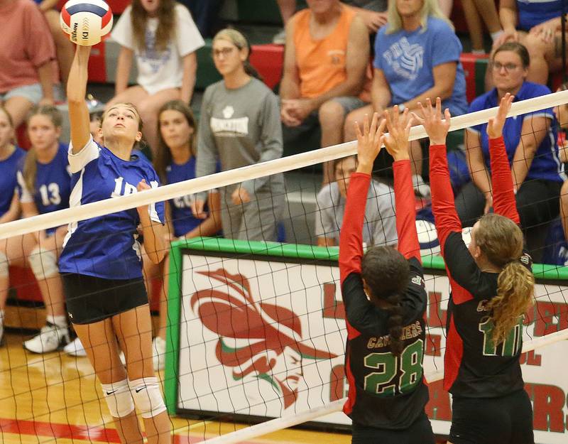 Princeton's Kathy Maciczak sends the ball past L-P's Ava Currie and teammate Katie Sowers on Tuesday, Aug. 22, 2023 in Sellett Gymnasium.