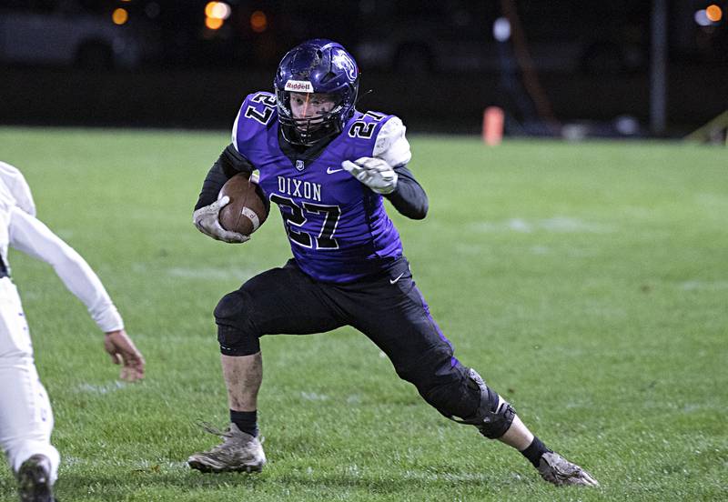 Dixon’s Eli Davidson looks for running room in a first round playoff game against Plano Friday, Oct. 27, 2023 in Dixon.