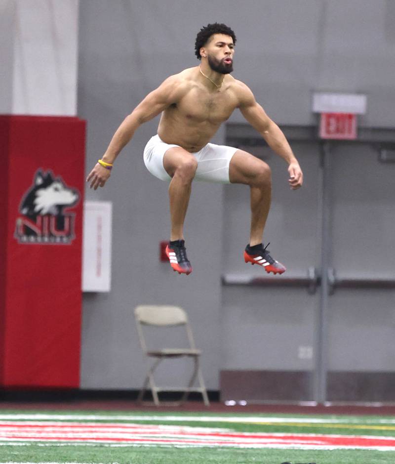 Former Western Illinois University and DeKalb High School receiver Tony Tate does some jumping to get loose before running his 40-yard dash Wednesday, March 30, 2022, during pro day in the Chessick Practice Center at NIU. Several NFL teams had scouts on hand to evaluate the players ahead of the upcoming draft.