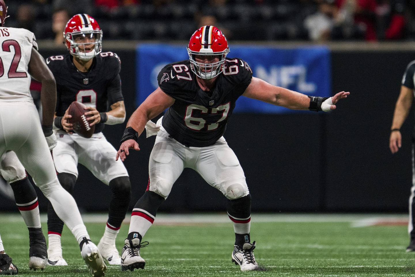 Atlanta Falcons center Drew Dalman (67) works during the second half of an NFL football game against the Washington Commanders, Sunday, Oct. 15, 2023, in Atlanta. The Washington Commanders won 24-16. (AP Photo/Danny Karnik)