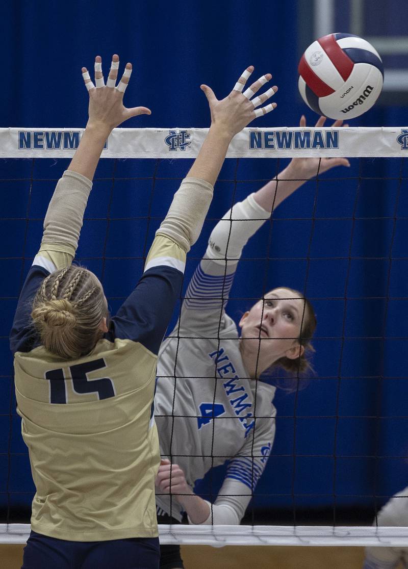 Newman’s Ruby Burger spikes the ball against Mercer County’s Rylee Bigham Wednesday, Sept. 24, 2025.