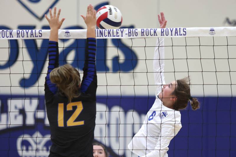 Hinckley-Big Rock's Courtlyn Brockway spikes the ball as Somonauk's Olivia Taylor goes for a block during their match Thursday, Sept. 15, 2022, at Hinckley-Big Rock High School.