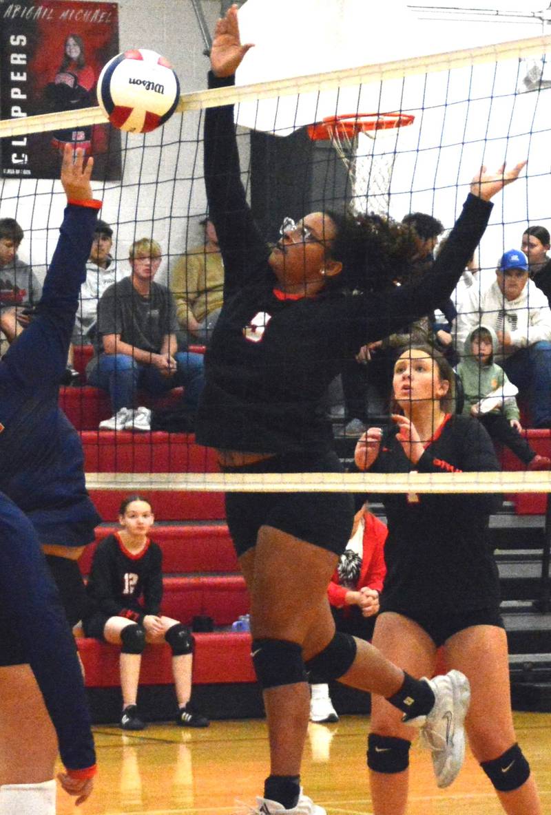 LaMoille's Olivia Glasper defends the net in Tuesday's match vs. DePue at Dean Madsen Gymnasium. The Lions scored a senior night victory for their first win of the season.