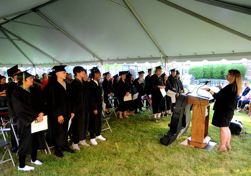 Julie Duncan, administrator of Haber Oaks Campus, presents the graduates Thursday, May 12, 2022, during the school's graduation in the courtyard of Crystal Lake South High School.