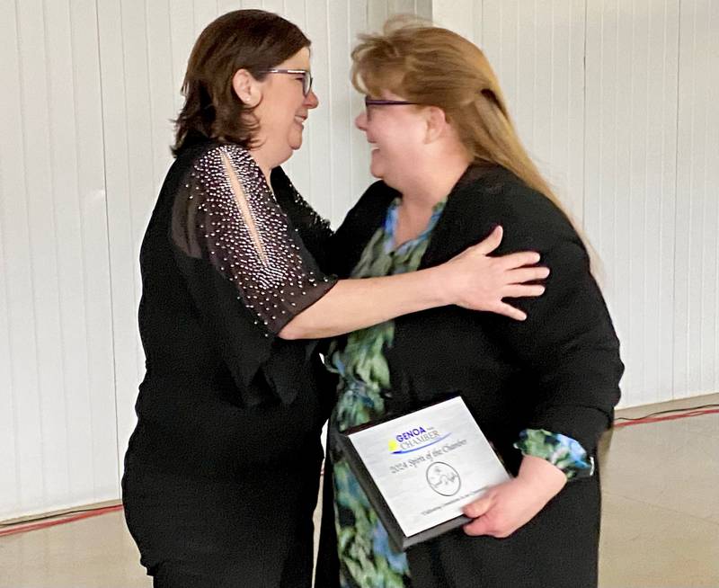 Genoa Area Chamber of Commerce executive director Krissy Johnson (left) embraces Melissa Freund, owner of confectionary Sweet-DeLights, after presenting Freund with the 2024 Spirit of the Chamber Award on Thursday, Feb. 13, 2025, at the chamber's 68th Annual Meeting and Awards Dinner at Custom Aluminum Products, 312 Eureka St., Genoa.