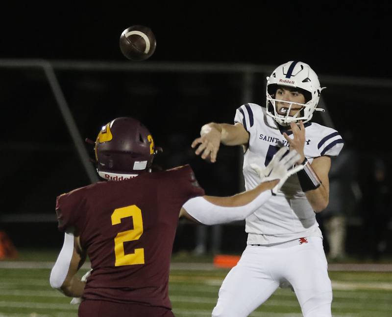 Richmond-Burton's Jeff Lehn pressures St. Viator's Cooper Kmet  during a IHSA Class 4A first round playoff football game Friday, Oct. 27, 2023, at Richmond-Burton High School in Richmond.