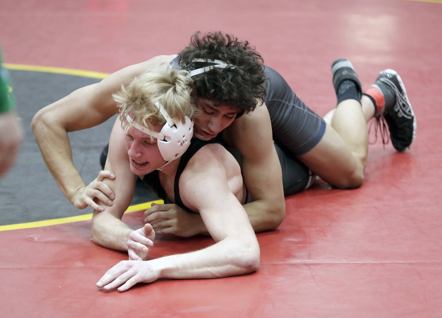 Chicago Hope's Franky Saez, (top) wrestles Downers Grove North's Matt McCormick at 152-pounds during the Batavia Invitational Saturday January 15, 2022 in Batavia.