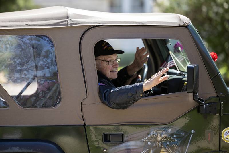 A Vietnam veteran waves from a moving vehicle Saturday, April, 26, 2025, in Dixon. Dixon VFW Post 540 held a Vietnam Veteran parade down Galena Avenue to recognize those veterans who didn’t receive the thank you they deserved.