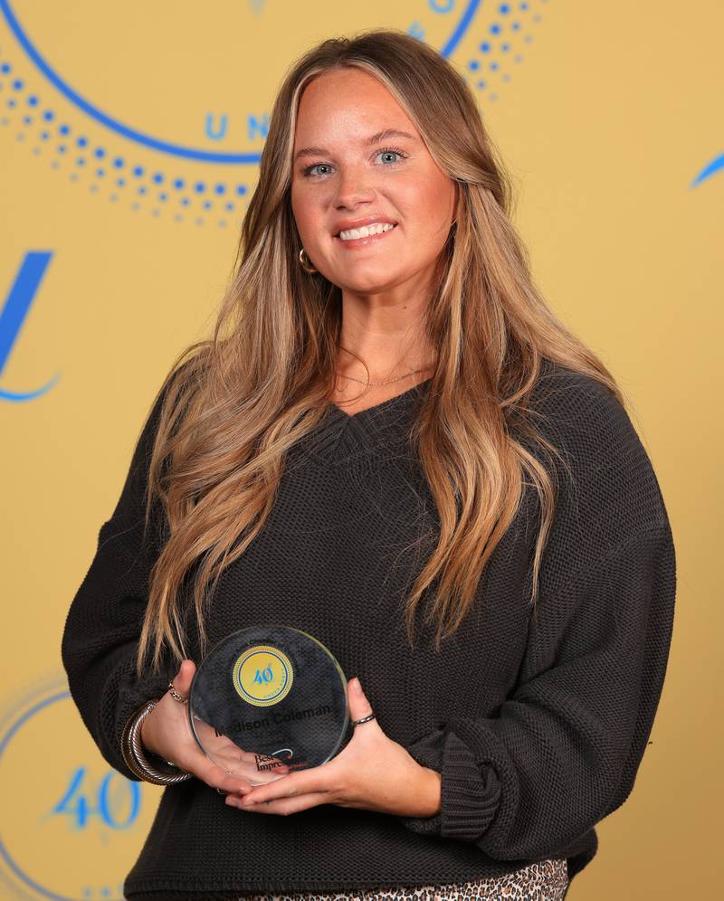 Madison Coleman poses with her 40 Under Forty award during the Illinois Valley Chamber of Commerce Champions of Change Awards Night on Thursday, April 10, 2025 at the Westclox Event Center in Peru.