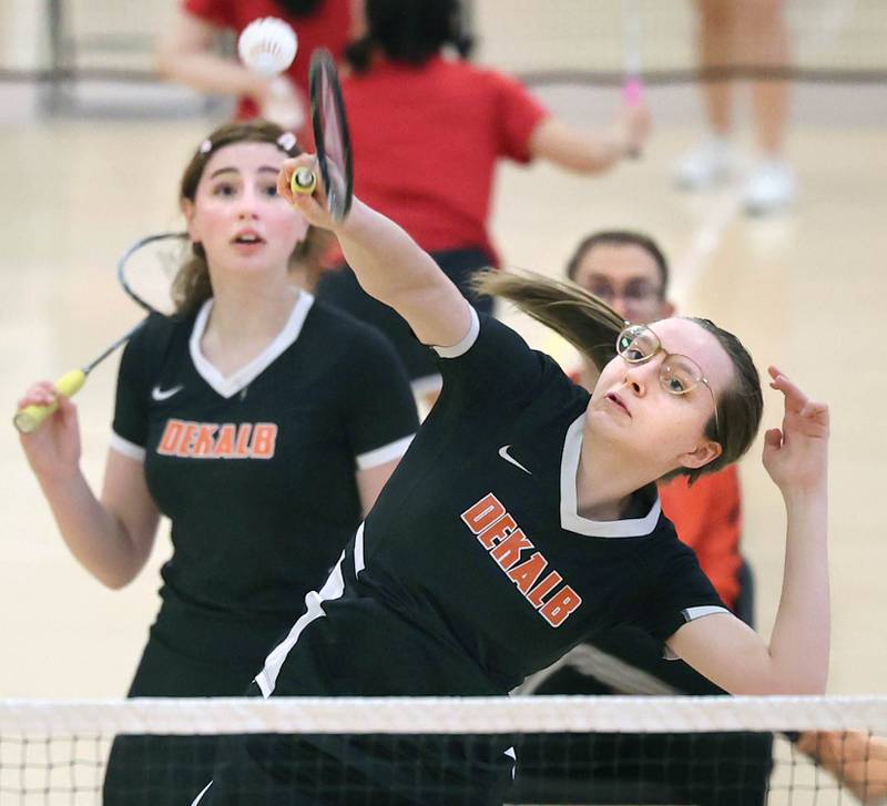 DeKalb’s Lea Guelde puts away a shot as her partner Kaitlyn Davis looks on Friday, May 12, 2023, during their doubles match against Joliet Central at the IHSA State Badminton Finals at DeKalb High School.