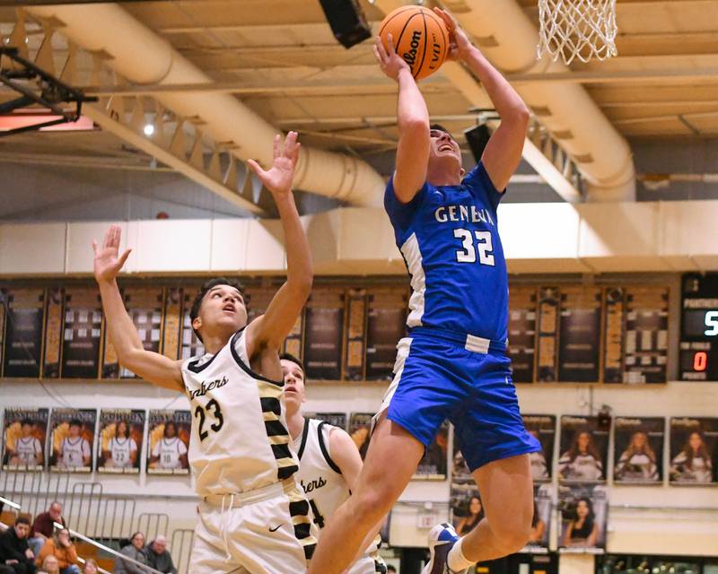 Geneva's Benjamin Peterson (32) makes a basket while being defended by Glenbard North's Caeden Chilton (23) during the game on Tuesday Jan. 6, 2025, held at Glenbard North High School.