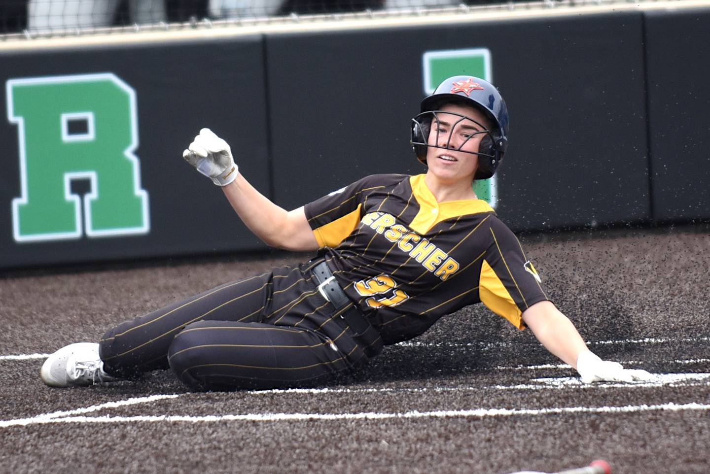 Herscher's RyLyn Adams slides in to score the first run of the Tigers' Class 2A Seneca Sectional semifinal against Beecher Tuesday, May 27, 2025.