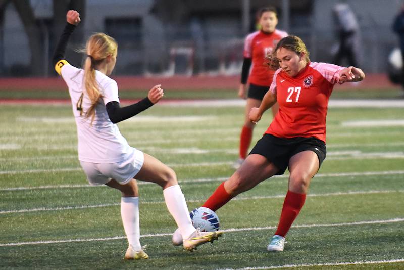 Bradley-Bourbonnais' Aaliyah Lanum, right, takes a shot as Bishop McNamara's Lydia Nugent defends during a game at Bradley-Bourbonnais Tuesday, April 1, 2025.