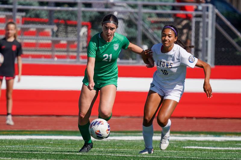 York’s Andriana Soupos (21) and Lyons’ Leahla Frazier (16) race to the ball during a Class 3A Hinsdale Central Sectional girls soccer championship match at Hinsdale Central High School on Saturday, May 25, 2024.