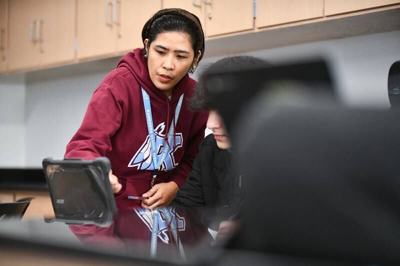 Jun Dumaguit, an international teacher from the Philippines, works with a student on Friday, Feb. 14, 2025, at Kankakee High School.