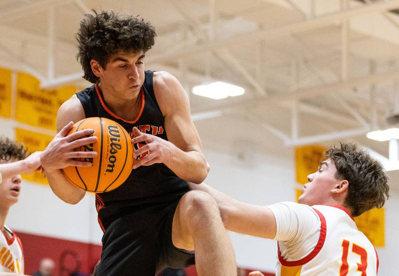 Wheaton Warrenville South’s Luca Carbonaro grabs a rebound during an away game against Batavia on Tuesday, Jan. 7, 2025.