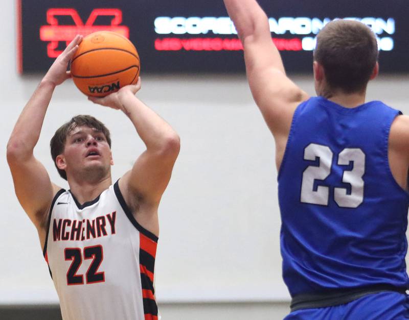 McHenry’s Conner McLean takes an outside shot against Burlington Central in varsity boys basketball on Tuesday, Feb. 4, 2025, at  McHenry High School  in McHenry.