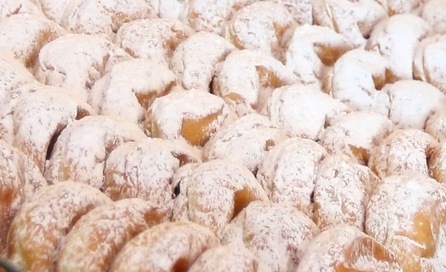 A close up of Paczki's at the Ottawa Bakery on Tuesday, Feb. 21, 2023 in Ottawa. Paczki, pronounced "puhnch-kee" are deep-fried doughnuts that are traditionally Polish and made by bakers using up ingredients before Lent begins.