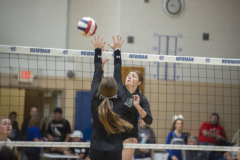 St. Bede’s Isabella Pinter spikes the ball against Newman Tuesday, Sept. 27, 2022.