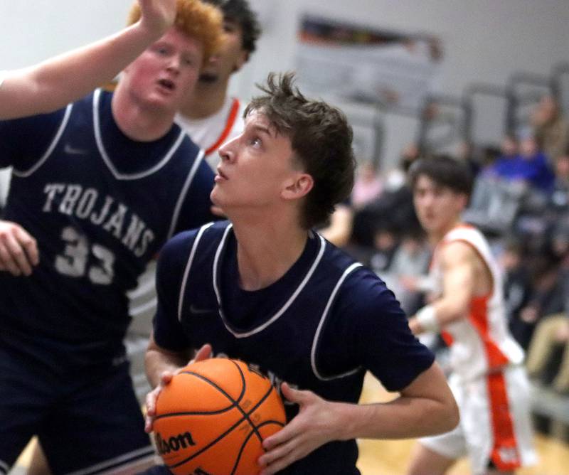 Cary-Grove’s Evan Bauer heads for the hoop in varsity boys basketball on Tuesday, Feb. 17, 2026, at McHenry High School in McHenry.