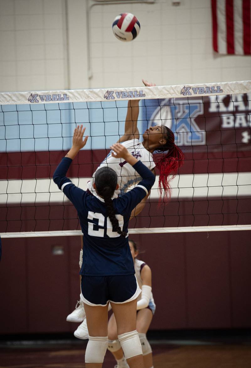 Kankakee's Ki'Asia Wilson elevates for a hit as Grace Christian's Arianna Trivino looks to defend during a match on Monday, September 22, 2025.