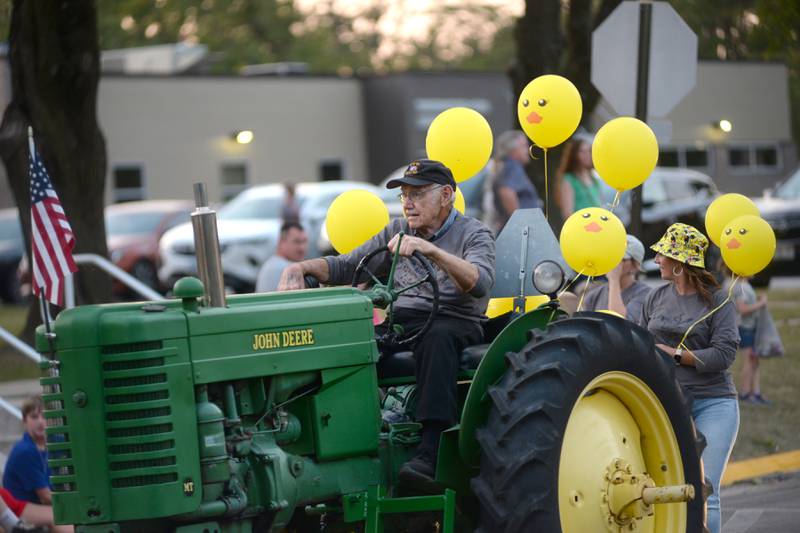 Stan Eden drives an antique John Deere tractor as part of Autumn on Parade's entry in the Oregon High School's homecoming parade on Wednesday, Sept. 18, 2024. Homecoming festivities continue this week. The Autumn on Parade festival is Oct. 4-5.