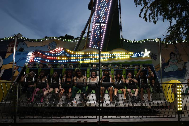 Festival goers enjoy one of the carnival rides on day two of Riot Fest. Saturday, Sept. 18, 2022, in Chicago.