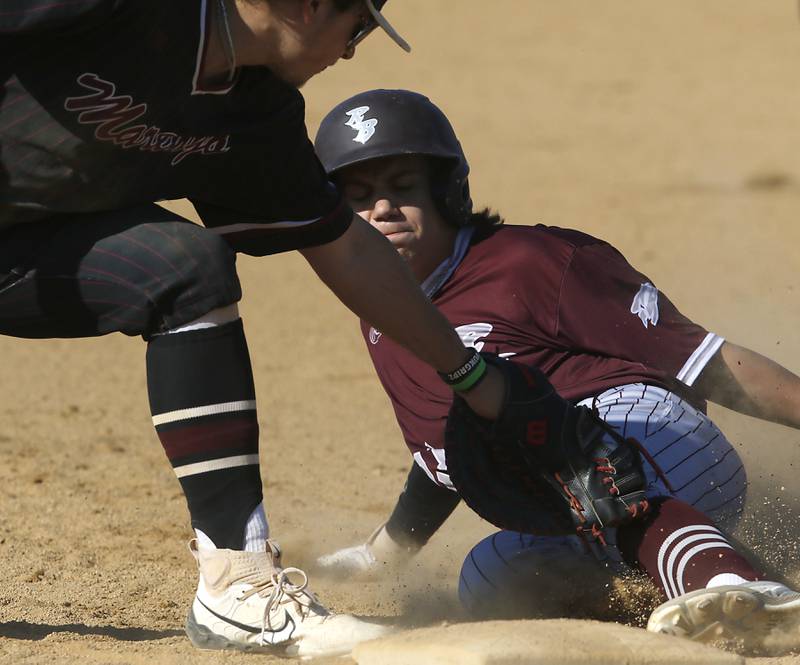 Marengo's Andrew Johnson tags out Richmond-Burton's Gavin Busa during a Kishwaukee River Conference baseball game on Thursday, April 25, 2024, at Marengo High School.