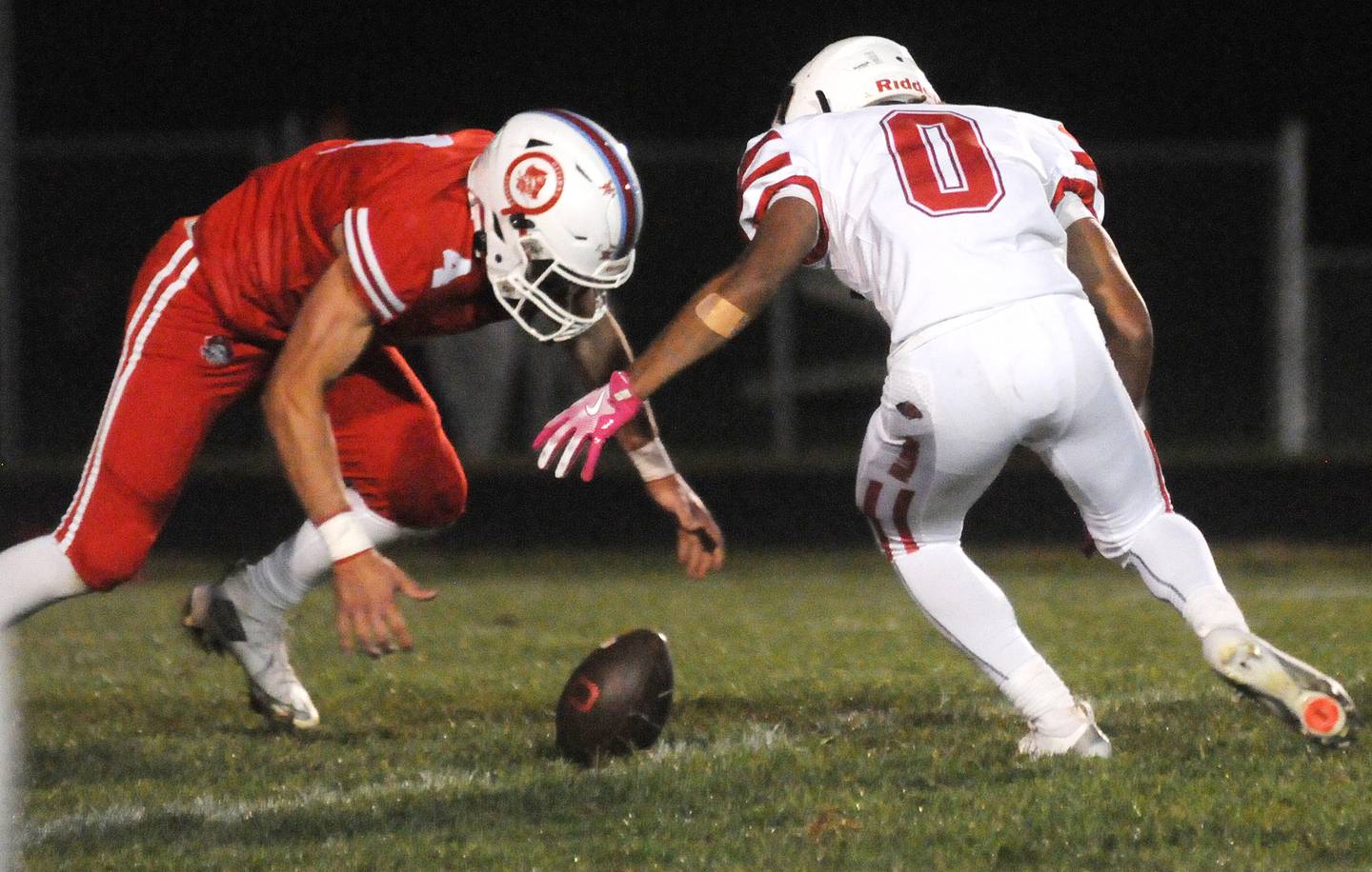 Ottawa's Logan Mills (4) and Streator's Layzeric Moton scramble after a Streator kickoff fumble on Friday, Sept. 5, 2025 at King Field.
