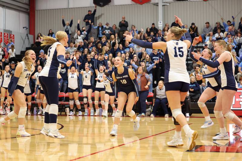 Cissna Park's Kendyl Neukomm, center, turns to celebrate with teammates, from left, Josie Neukomm, Mady Marcott, Ava Henrichs, Addison Lucht and Sophie Duis during the Timberwolves' victory in two sets, 25-22, 25-11, over Windsor/Stewardson-Strasburg in the IHSA Class 1A Heyworth Super-Sectional on Monday, Nov. 10, 2025.