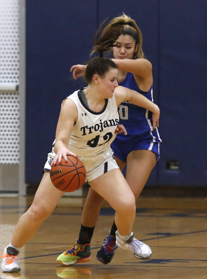 Cary-Grove's Emily Larry tries to drive around Burlington Central's Samantha Origel during a Fox Valley Conference girls basketball game Friday Jan. 6, 2023, at Cary-Grove High School in Cary.