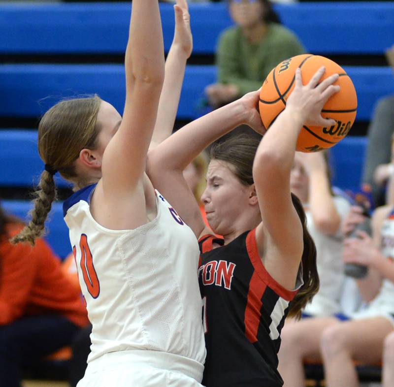 Fulton's Wrenn Coffey (10) protects the ball from an Eastland player during a Friday, Dec. 13, 2024 game at Eastland High School in Lanark.