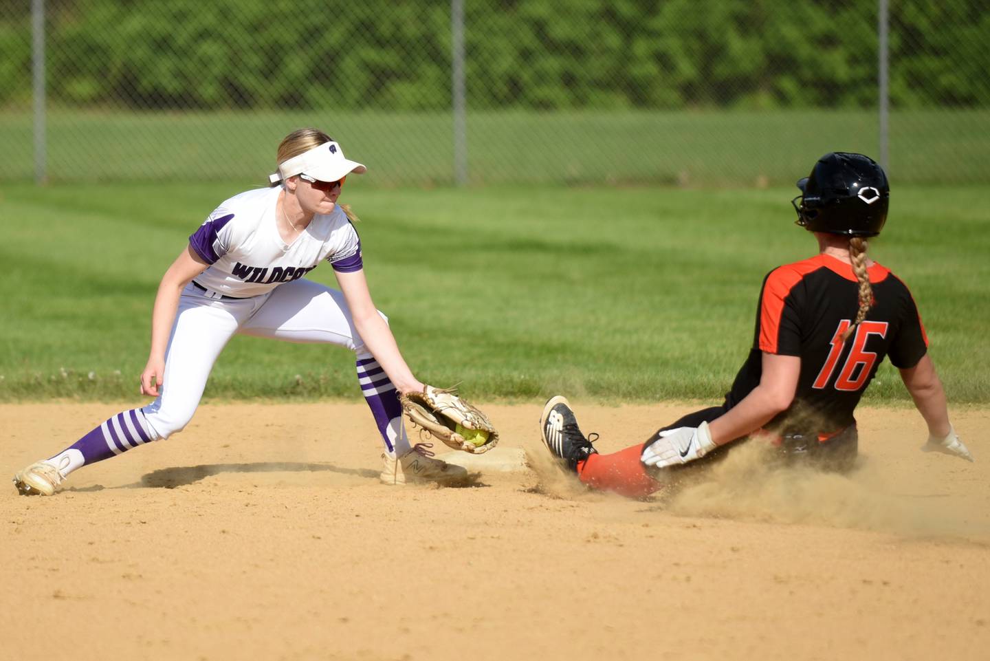 Wilmington's Nina Egizio, left, tags Beecher's Maddie Grooms out at second base during a game at Wilmington Thursday, April 23, 2026.