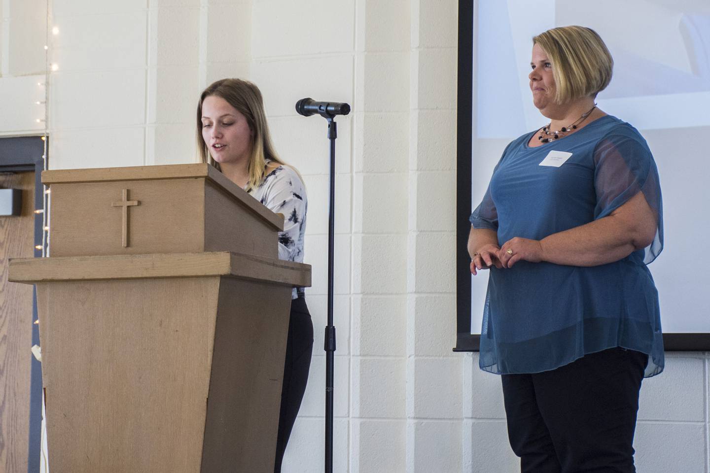 Genoa-Kingston School District 7th Grade English and Language Arts Teacher Karmen Ewald being introduced and recognized by one of her students.