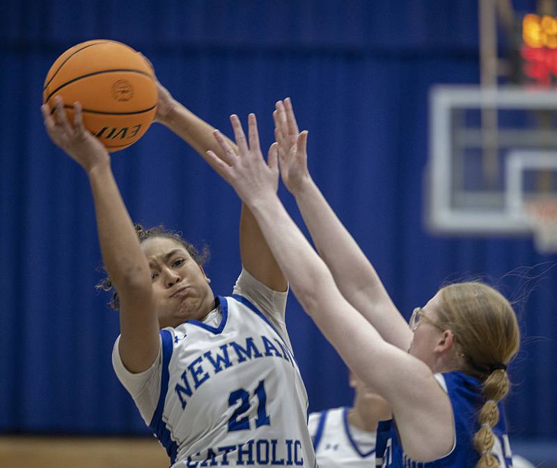 Newman’s Gisselle Martin hauls in a pass in front of Princeton’s Danika Burden Thursday, Jan. 15, 2026.