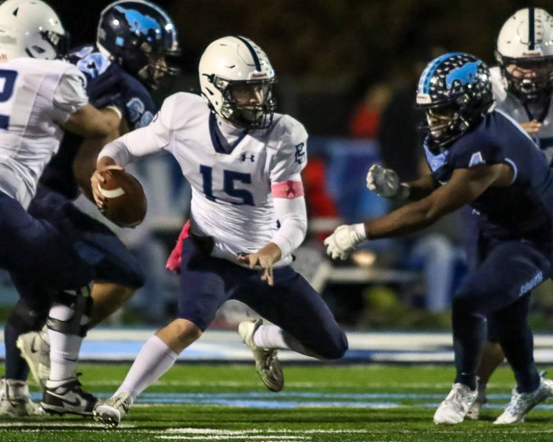 Plainfield South's Cody Hogan (15) takes off with the ball on a designed run during Class 8A Playoff football game between Plainfield South at Downers Grove South on Friday, Nov 1, 2024  in Downers Grove.