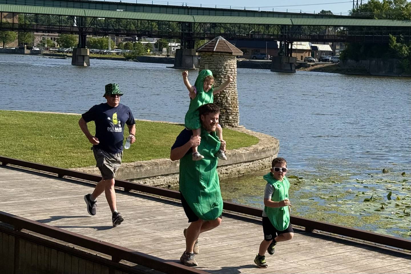 St. Charles resident Charlie Benson
Charlie Benson runs toward the finish line in the Dill Dash with his own little “gherkins”, daughter Genevieve, 4 and son Marty, 6, during the second annual Pickle Paradise festival at Pottawatomie Park in St. Charles on June 20, 2025.