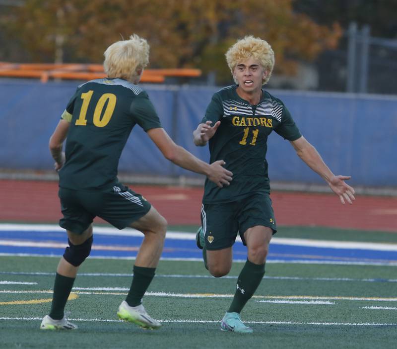 Crystal Lake South's Nolan Getzinger rushes to Nico Velasco after Velasco scored a first half goal during the IHSA Class 2A state championship soccer match against Peoria Notre Dame on Saturday, Nov. 4, 2023, at Hoffman Estates High School.