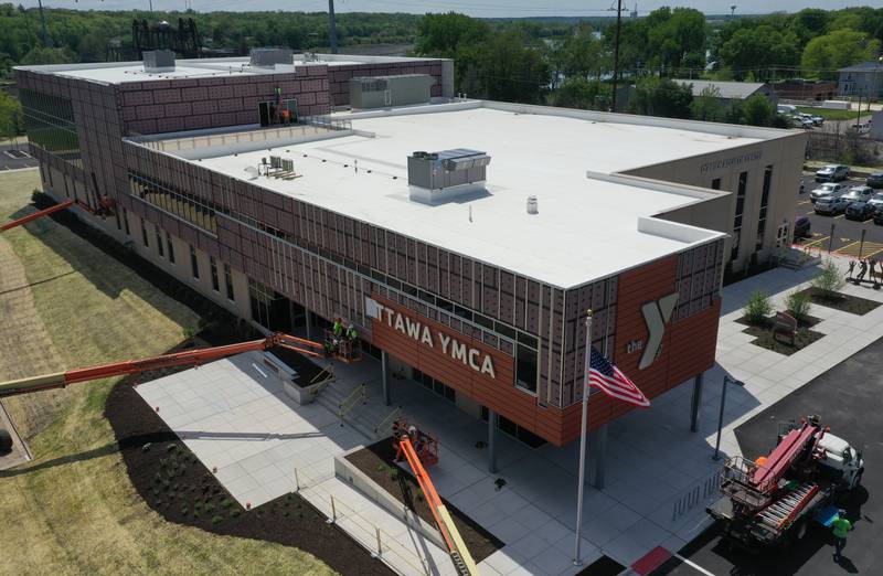 An aerial view of crews installing letters spelling "Ottawa YMCA" on Monday, May 6, 2024 at the new YMCA in Ottawa.