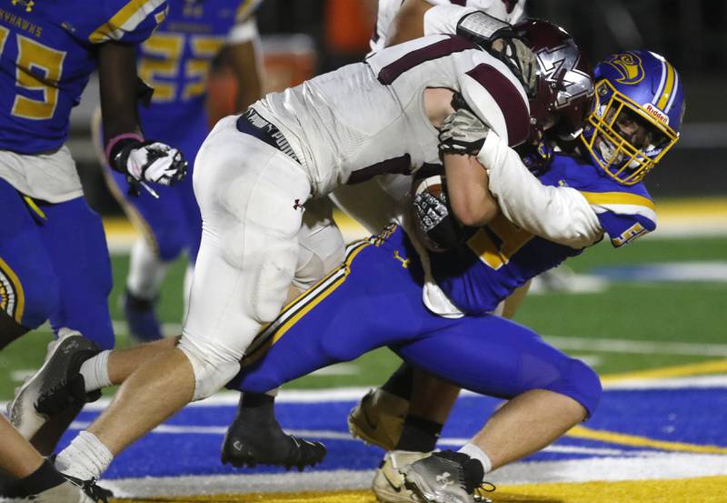 Johnsburg's Jackson Rittorno tackles Marengo's Connor Sacco during a Kishwaukee River Conference football game on Friday, Oct. 4, 2024, at Johnsburg High School.