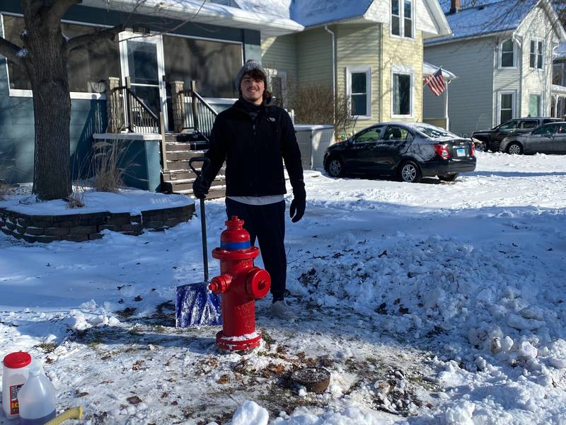 Morris High School student Caleb Stage after clearing the hydrant in his neighborhood.