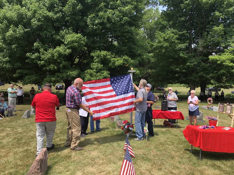 Van Hoozen family, Alden veterans honored with flag pole, memorial at