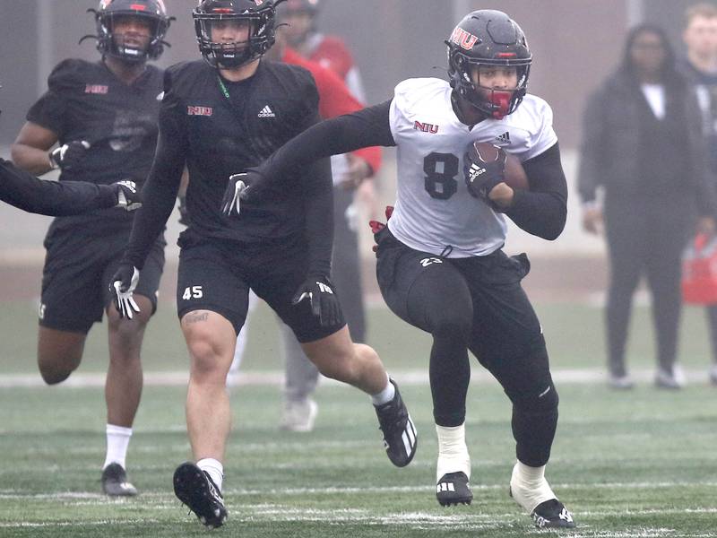 Northern Illinois University tight end Miles Joiner runs after making a catch during 11-on-11 drills in a foggy Huskie Stadium at spring practice Wednesday, March 23, 2022,at NIU in DeKalb.
