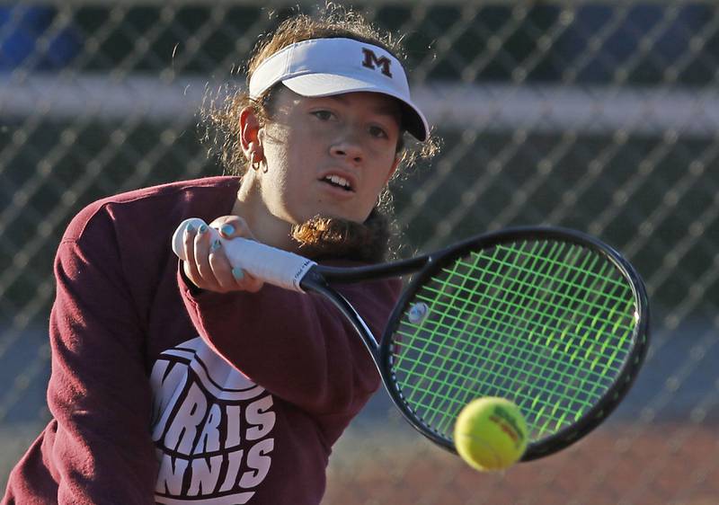 Morris' Skyler Saelens returns the ball Thursday, Oct. 23, 2025, during the first day of the IHSA State Girls Tennis Tournament at Schaumburg High School.