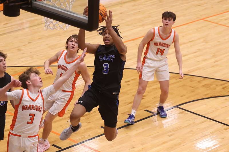 Lincoln-Way East’s Brenden Sanders goes in for the layup against Lincoln-Way West on Tuesday, Jan. 7, 2025 in New Lenox